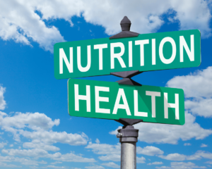 A signboard with the words 'Nutrition and Health' against a sky background, symbolizing the importance of healthy eating for overall well-being.