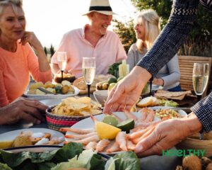 Flat illustration of people enjoying a Mediterranean-style meal together outdoors"